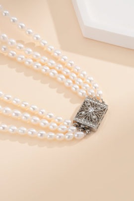 The Secret to Layering Pearl Jewelry Like a Stylist