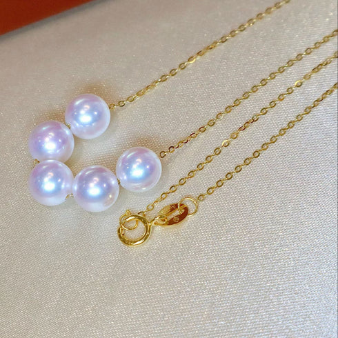 Pearl necklace with 5–6mm white Akoya pearls on an 18K gold chain by House Of Pearls