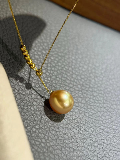 10-11mm Golden South Sea Pearl Y necklace with a large pearl pendant on a gold chain