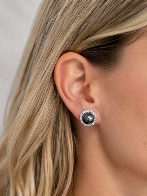 Stud earrings: House Of Pearls XM Tahitian Pearl floral halo with black pearl and diamond halo, silver-tone.