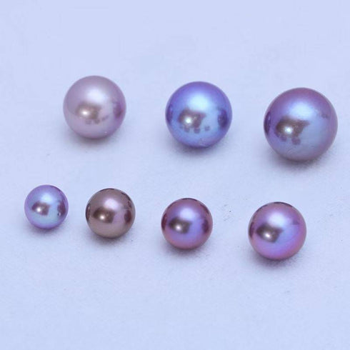 9-11mm purple freshwater pearl necklace; 7 loose pearls shown