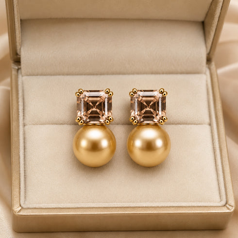 Earrings: pair of 10–11mm Golden South Sea champagne cube stud earrings with gold-toned setting.