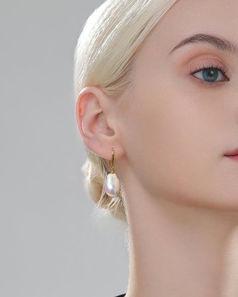Classic hoop baroque pearl earrings: gold-tone hoops with a dangling 10–12mm pearl.