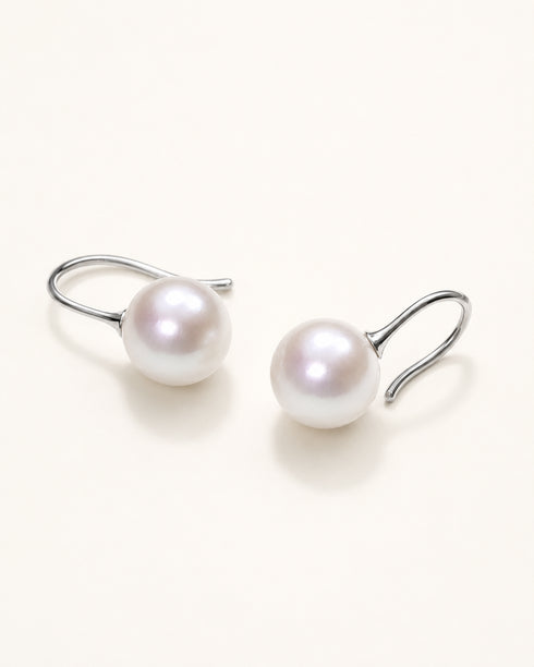 Pair of 10–11mm freshwater pearl hook earrings on silver hooks with white iridescent pearls