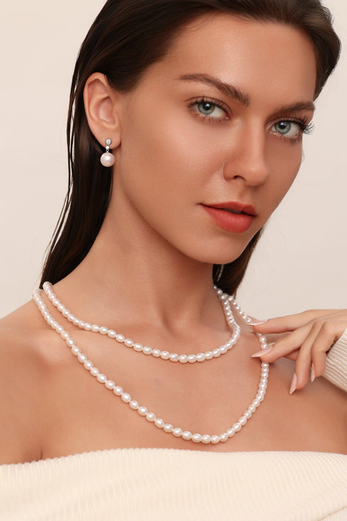 Earrings: 11–12mm freshwater pearl zircon drop earrings with white pearls and clear stones.