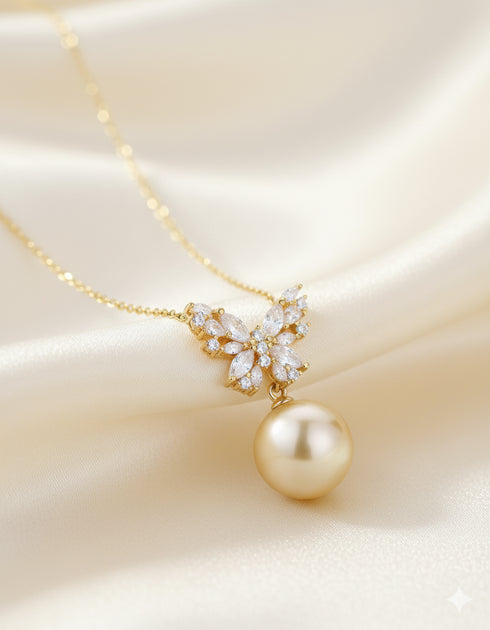 Butterfly pendant necklace with 11–12mm South Sea golden pearl and cubic zirconia accents on a gold chain by House Of Pearls.