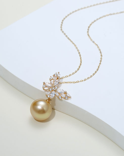 Butterfly pendant necklace with cubic zirconia stones and an 11–12mm South Sea golden pearl on a gold chain