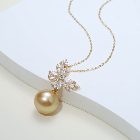 Butterfly pendant necklace with cubic zirconia stones and an 11–12mm South Sea golden pearl on a gold chain