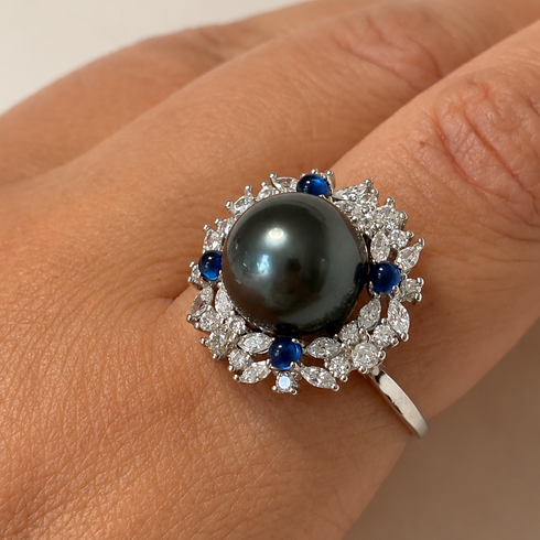 Ring, 11–12mm Tahitian pearl sapphire halo with diamond surround on a white metal band, House Of Pearls XM