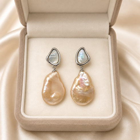 Earrings featuring 11–13mm peach freshwater baroque pearl drops with silver shell-stud tops (pair)