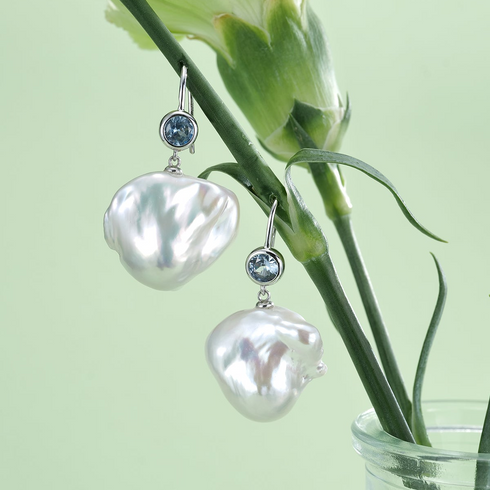 Pair of earrings: blue kyanite stones with large baroque pearl drops on silver hooks