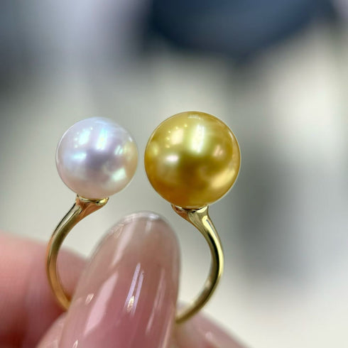 Ring with two pearls: Golden South Sea and Akoya pearls on a gold band by House of Pearls TA