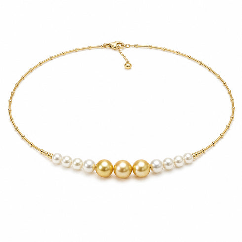 Choker necklace with white Akoya pearls and golden South Sea pearls on an 18K gold chain