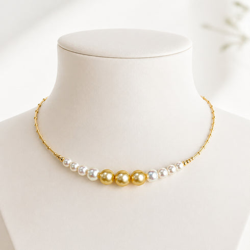 Choker necklace with center row of gold South Sea pearls and side white Akoya pearls, 18K gold.
