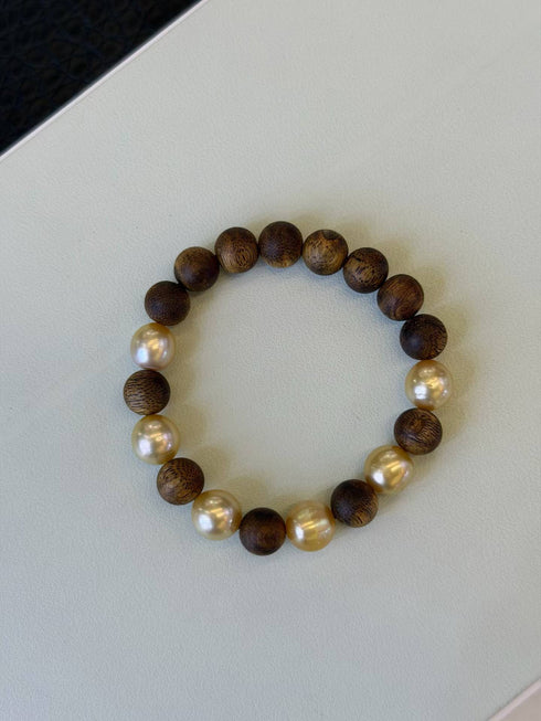 Bracelet with alternating brown wood beads and white freshwater pearls