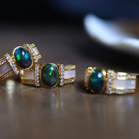 Natural Black Opal & Mother-of-Pearl Adjustable Statement Rings, three gold-tone rings with oval opals and white inlay.