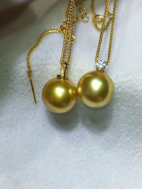 Pair of House Of Pearls Sasha pendant necklaces with 10–12mm golden South Sea pearls; one plain, one diamond-accent.
