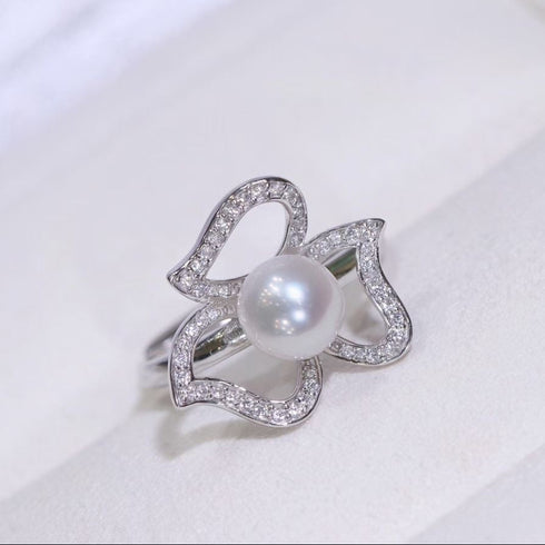 Ring: Aurora White Freshwater Pearl Floral Ring by House Of Pearls, featuring a white pearl center and diamond-studded petal motif.