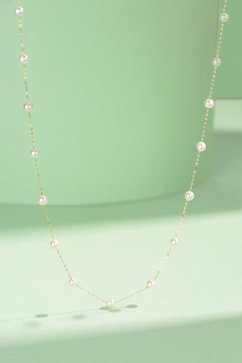 Tincup necklace with 3–4mm freshwater pearls on an 18K gold chain
