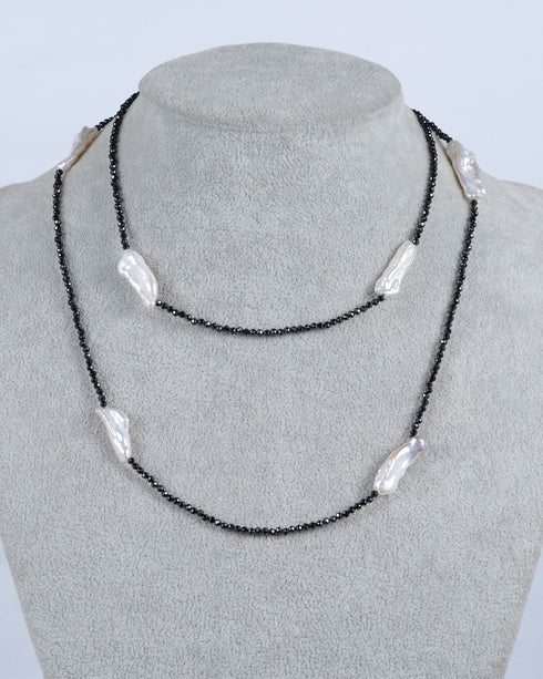 30-inch Black Spinel and White Baroque Pearl Long Necklace with black spinel beads and irregular white pearls.