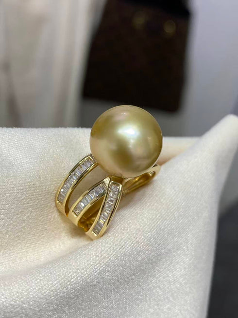 12-13mm Golden South Sea Pearl Ring with a multi-band gold setting and channel-set diamonds