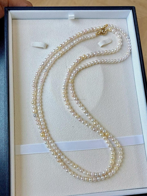 4–5mm Akoya Seawater Pearl Opera Necklace, white pearls with gold clasp in a white jewelry box.