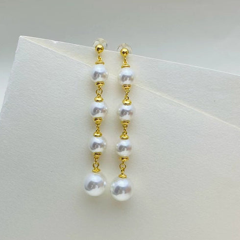 Pair of 6-7mm freshwater pearl drop earrings with high-luster pearls on gold-tone links