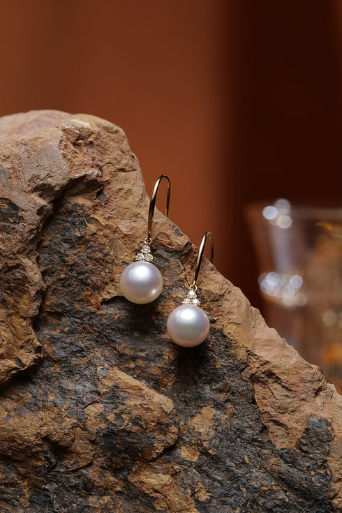 Earrings: 7-8mm white Akoya pearl drops with 18K gold hooks and diamond accents.