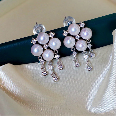 Earrings: 7-8mm Akoya pearl butterfly wing studs with crystal accents, House Of Pearls -LC