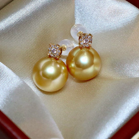 Pair of earrings with 10–12mm Golden South Sea pearls and diamond-set 18K gold caps, House Of Pearls - FT.