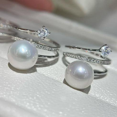 Rings by House Of Pearls: two Akoya pearl and pavé diamond bands on white metal.