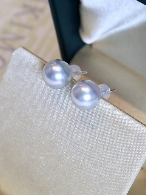 Pair of Akoya pearl stud earrings, 8–8.5mm silver-blue pearls on 18K white gold posts.