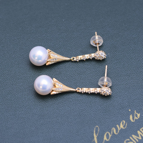 Pair of drop earrings with 8-9mm pale lavender freshwater pearls and CZ-daisy accents on gold-tone settings