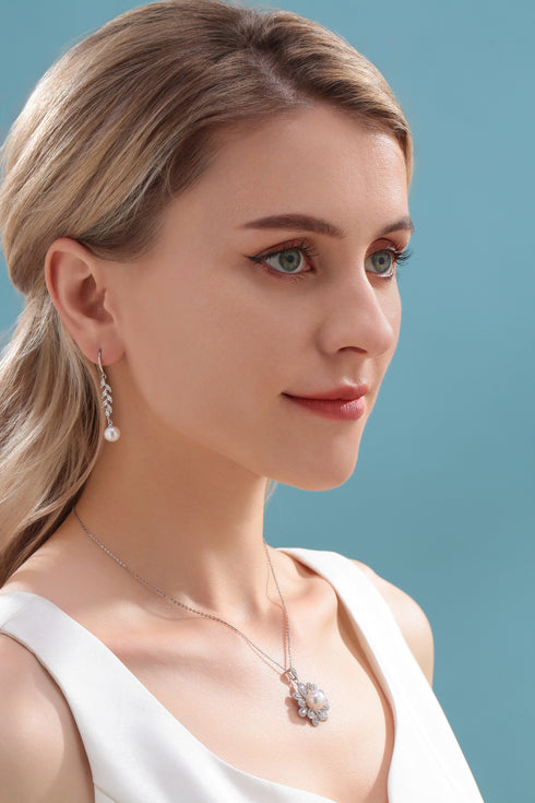 Earrings: 8-9mm freshwater pearl with long-leaf cubic zirconia drop, silver-tone