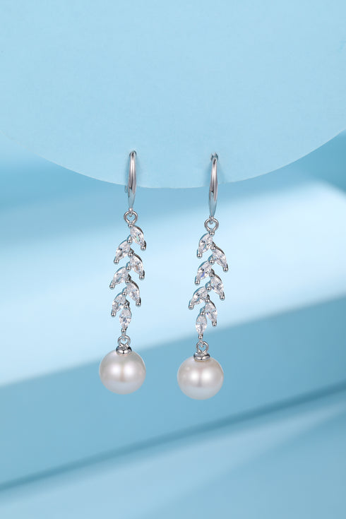 Earrings: 8-9mm freshwater pearl drops with long leaf cubic zirconia accents, silver-tone
