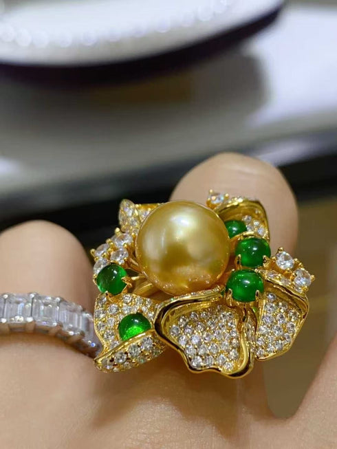 Ring: 12mm Golden South Sea pearl flower with diamond pave petals and green accent beads on a gold band