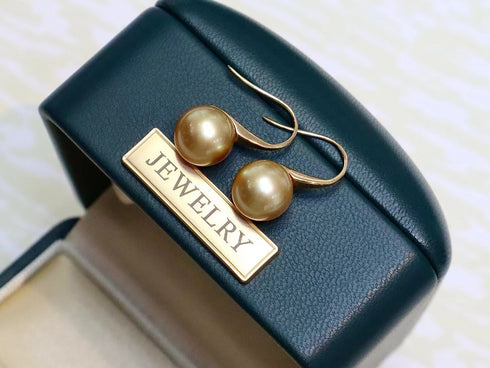 Earrings: pair of 9-10mm Golden South Sea pearl drop earrings with 18K gold hooks