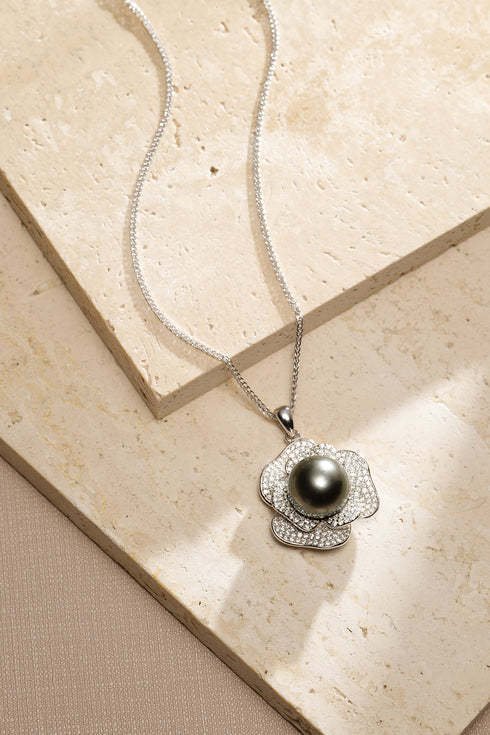 Miya pendant necklace with 9-10mm Tahitian black pearl in a diamond-studded flower setting on silver chain