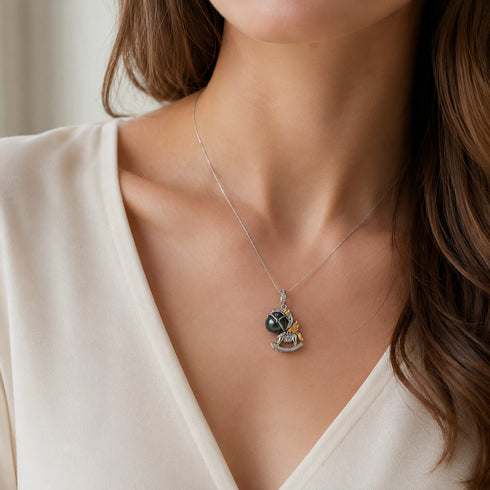 Tahitian Pearl Horse Pendant Necklace on a silver chain with a black-green pearl and gold-tone accents.