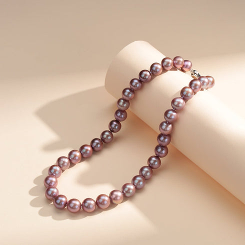 Two-strand 9-11mm Purple Freshwater Pearl Necklace with lavender pearls on a cream display