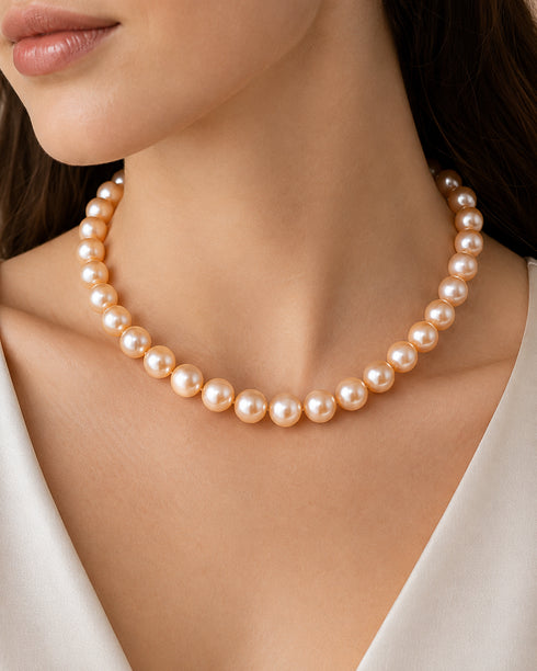 Edison pearl strand necklace in peach-pink, 9-11mm beads.