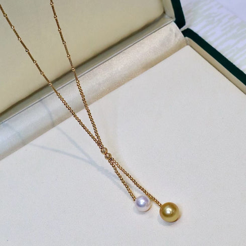 18K gold Y-necklace with Akoya white pearl and golden South Sea pearl; House of Pearls - TA
