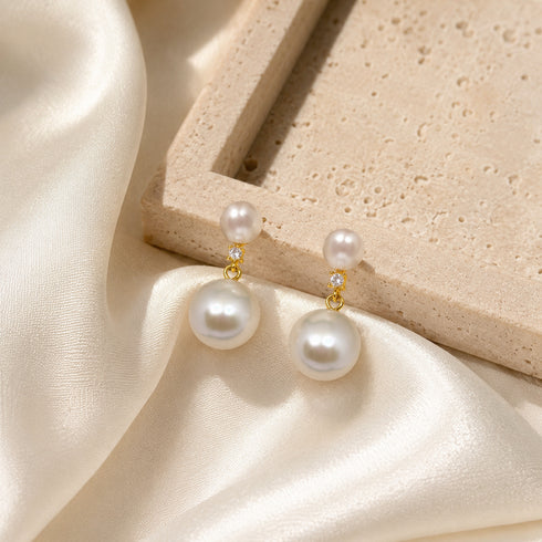 Earrings: 9–10mm freshwater pearl duo drop with small stud pearl and larger hanging pearl in gold setting