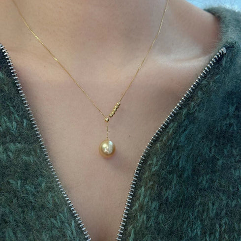 Golden South Sea Pearl Y necklace with a 10-11mm pearl pendant on a delicate gold chain
