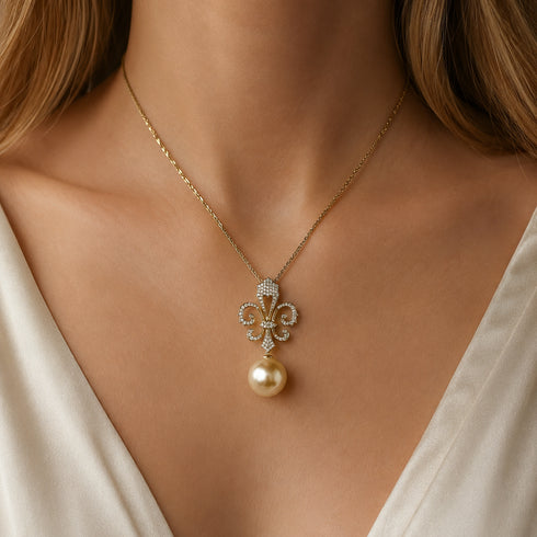 18K gold necklace with a diamond-studded fleur-de-lis pendant and a golden South Sea pearl drop
