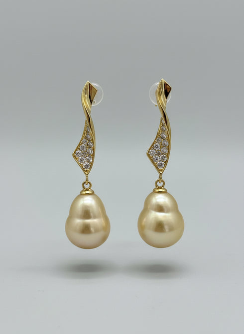 Earrings pair by House Of Pearls LC: gold drop with diamond-studded wave leaf and Golden South Sea baroque pearls