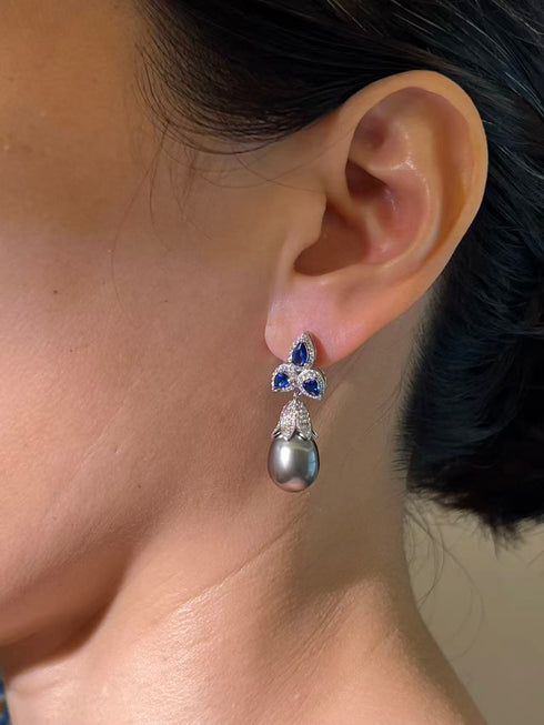 Drop earrings with 10–11mm Tahitian pearl, blue gemstone accents, and pavé diamonds in a silver-tone setting