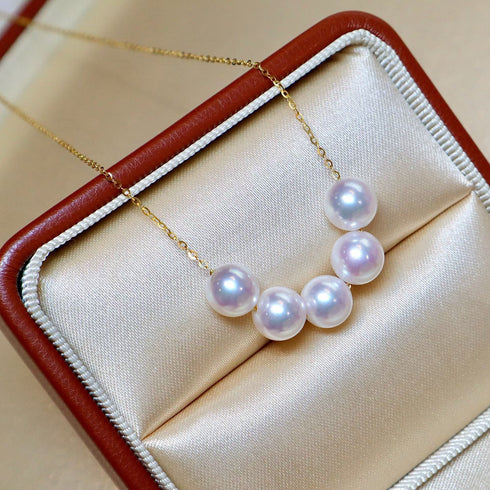 Necklace with 5–6mm white Akoya pearls on an 18K gold chain in a satin jewelry box by House Of Pearls -LC