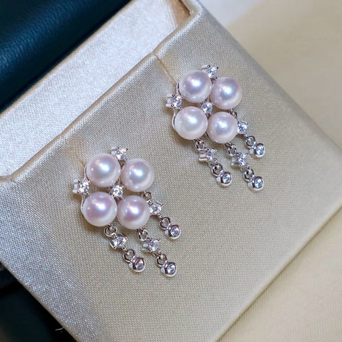 Earrings: 7-8mm Akoya pearl butterfly-wing design with silver setting and crystal accents by House Of Pearls -LC