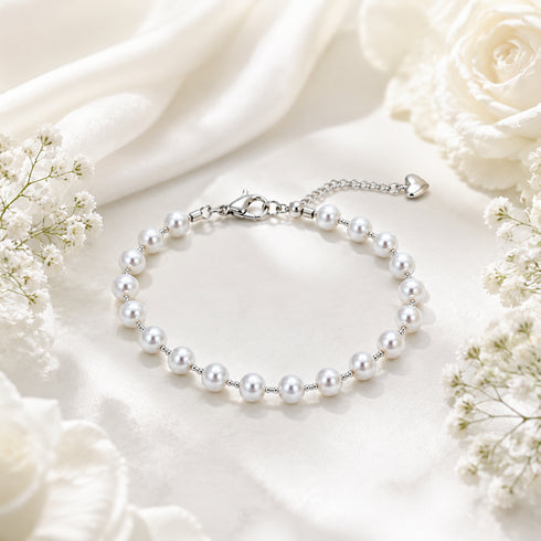 Bracelet with 5–6mm freshwater white pearls, dainty station design, silver-tone chain and lobster clasp